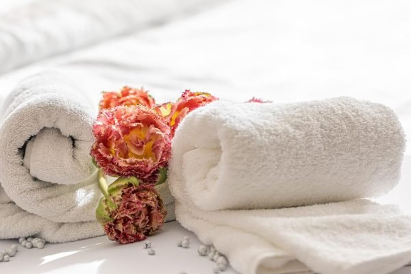 close-up-white-terry-bath-towels-and-flowers-2022-04-27-08-07-39-utc (1)